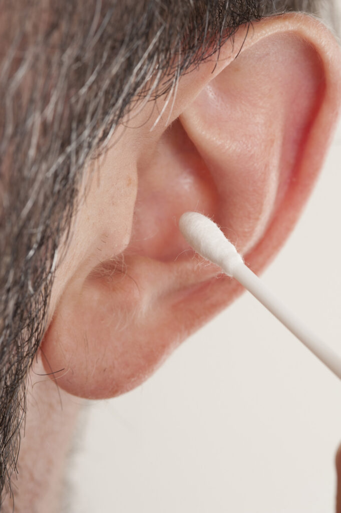 How to massage ear wax out